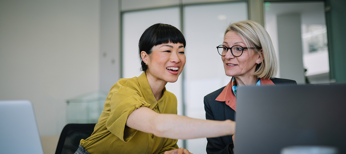 Two women in the office collaborating