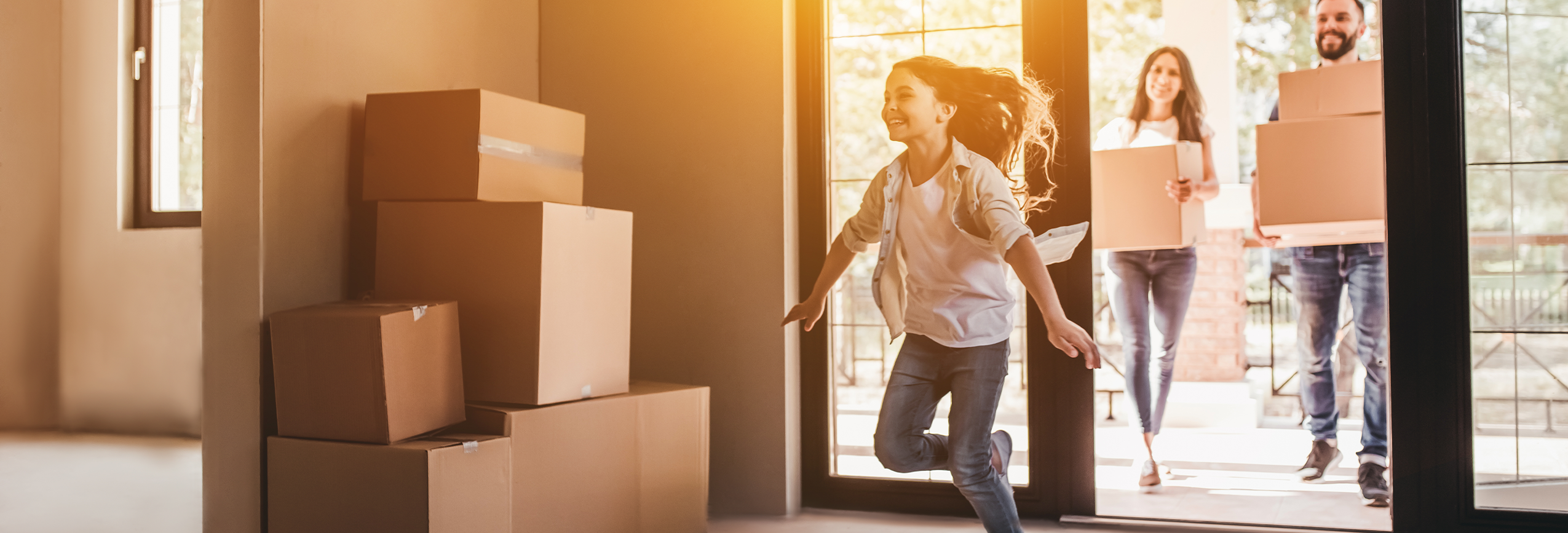 A family moving into a new home with moving boxes
