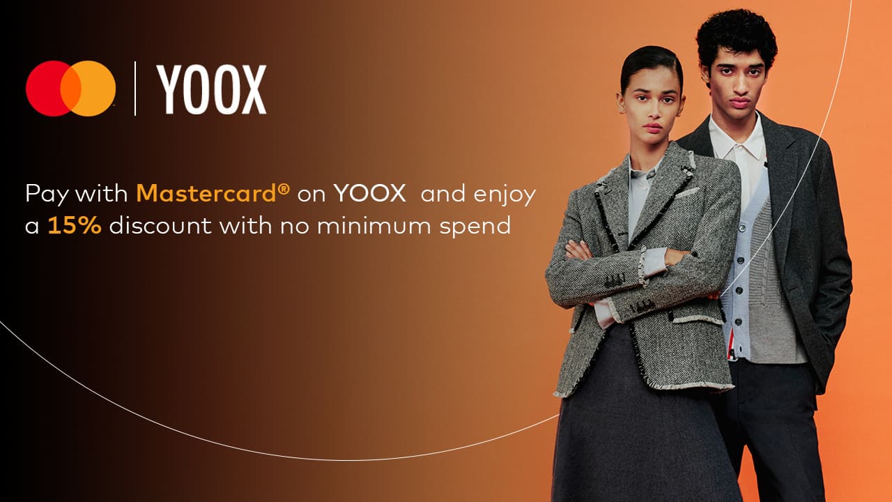 stylish models against bright orange backdrop