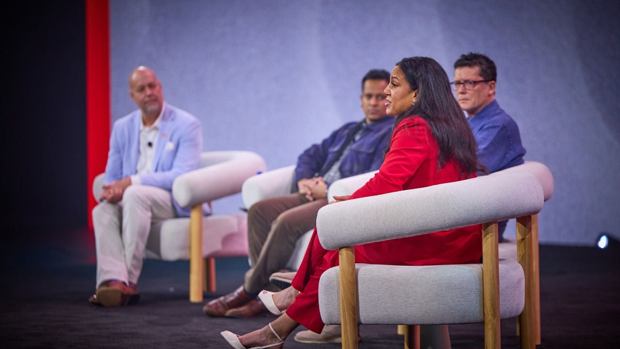 Panelists at Connections talk on stage. 