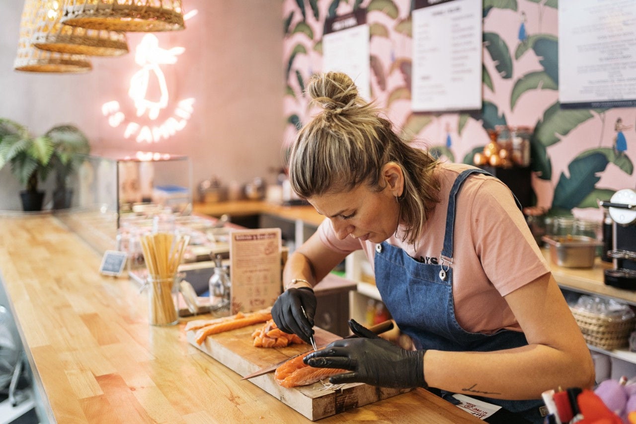 Restaurant worker preparing salmon