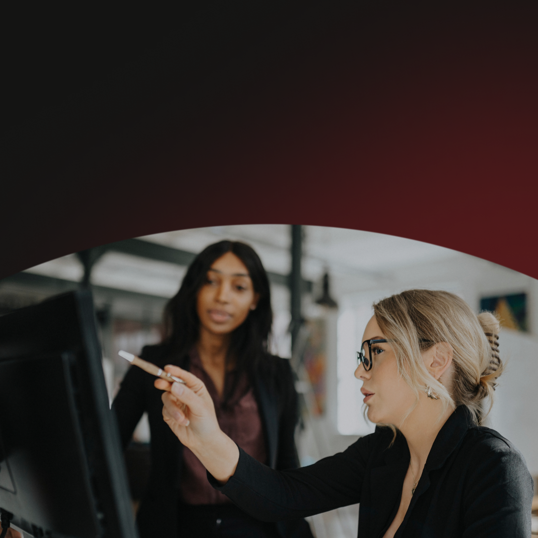 Business professionals in a meeting discussing how banks can utilize advanced cyber fraud fusion strategies to prevent cyber fraud