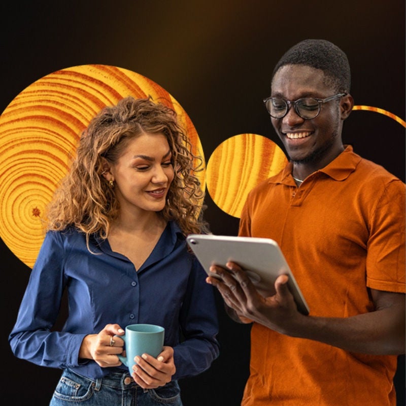 Two people look at a tablet. 