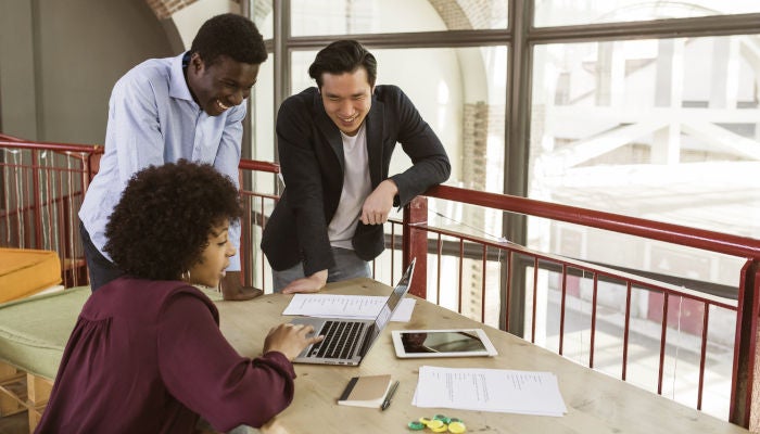 Young multi-racial businesspeople working in a modern startup in a contemporary office