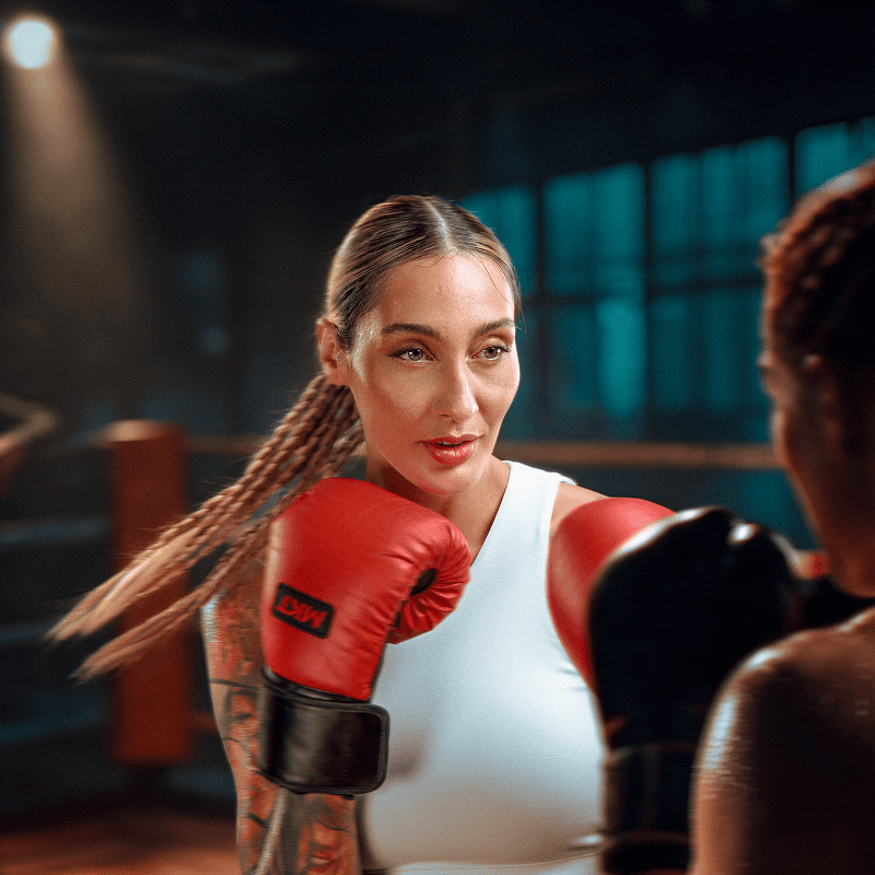 woman boxing with red gloves