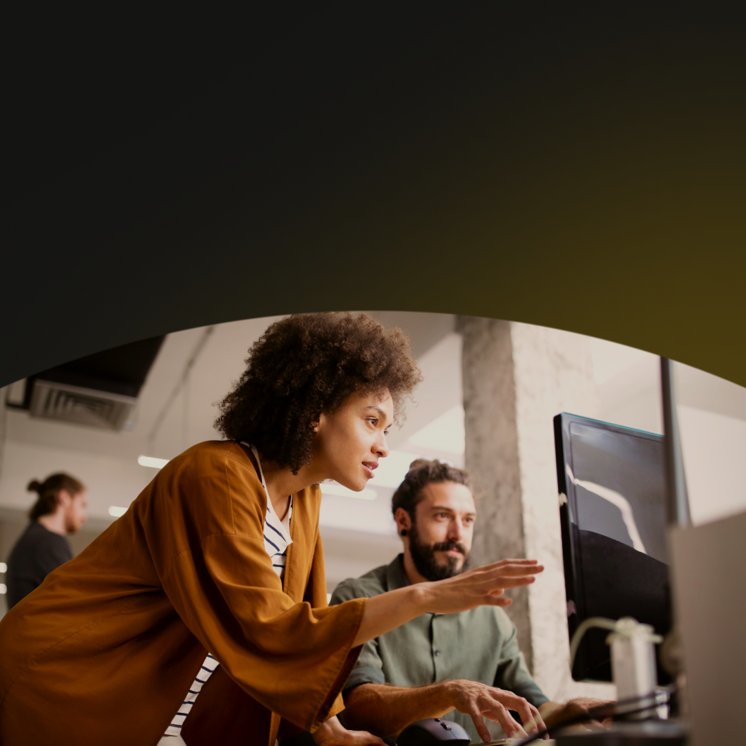 Coworkers brainstorming on the computer