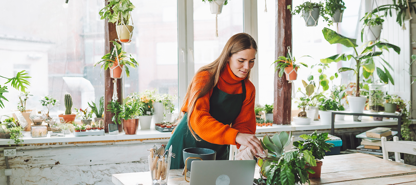 Woman in her plant store working