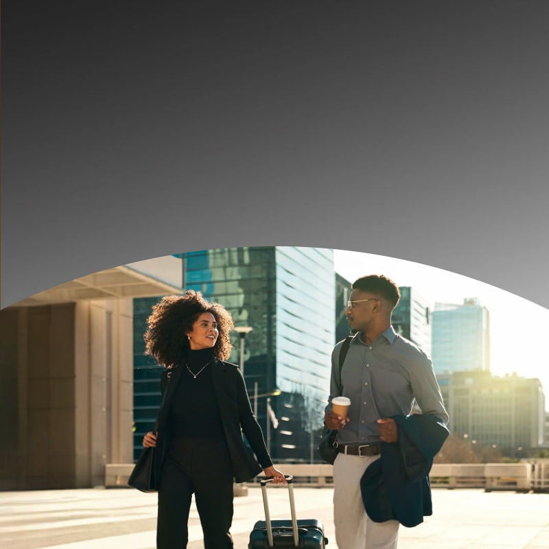 two business attire walking outdoors