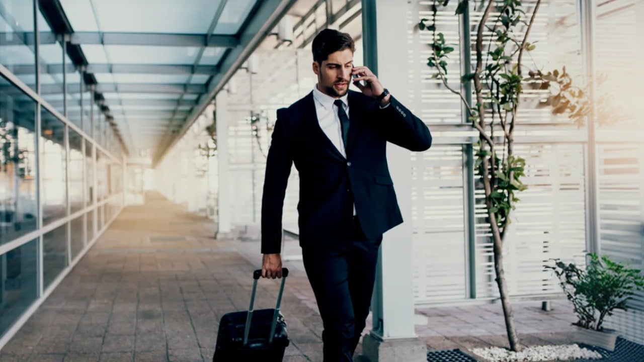 man walk with suitcase in airport