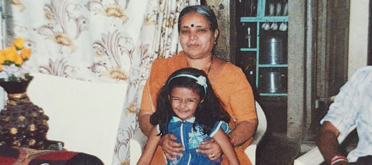 Woman sitting with daughter.