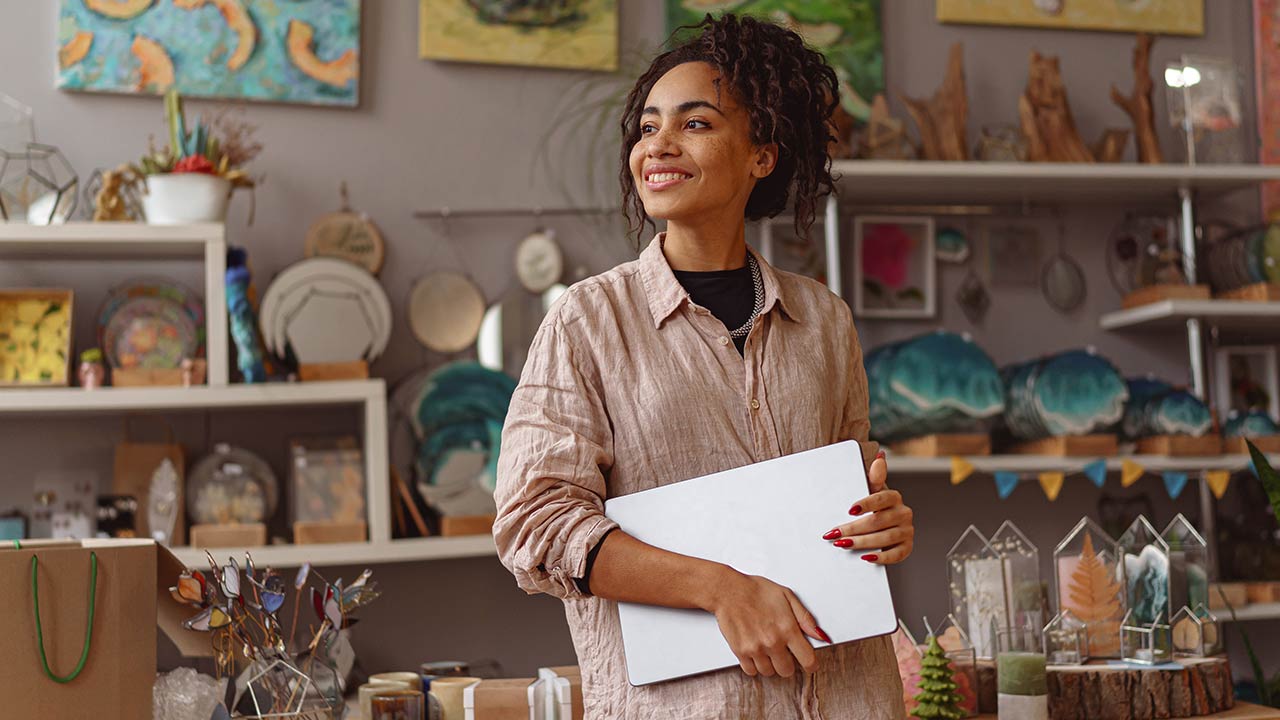 Female decorator working online from her art studio.