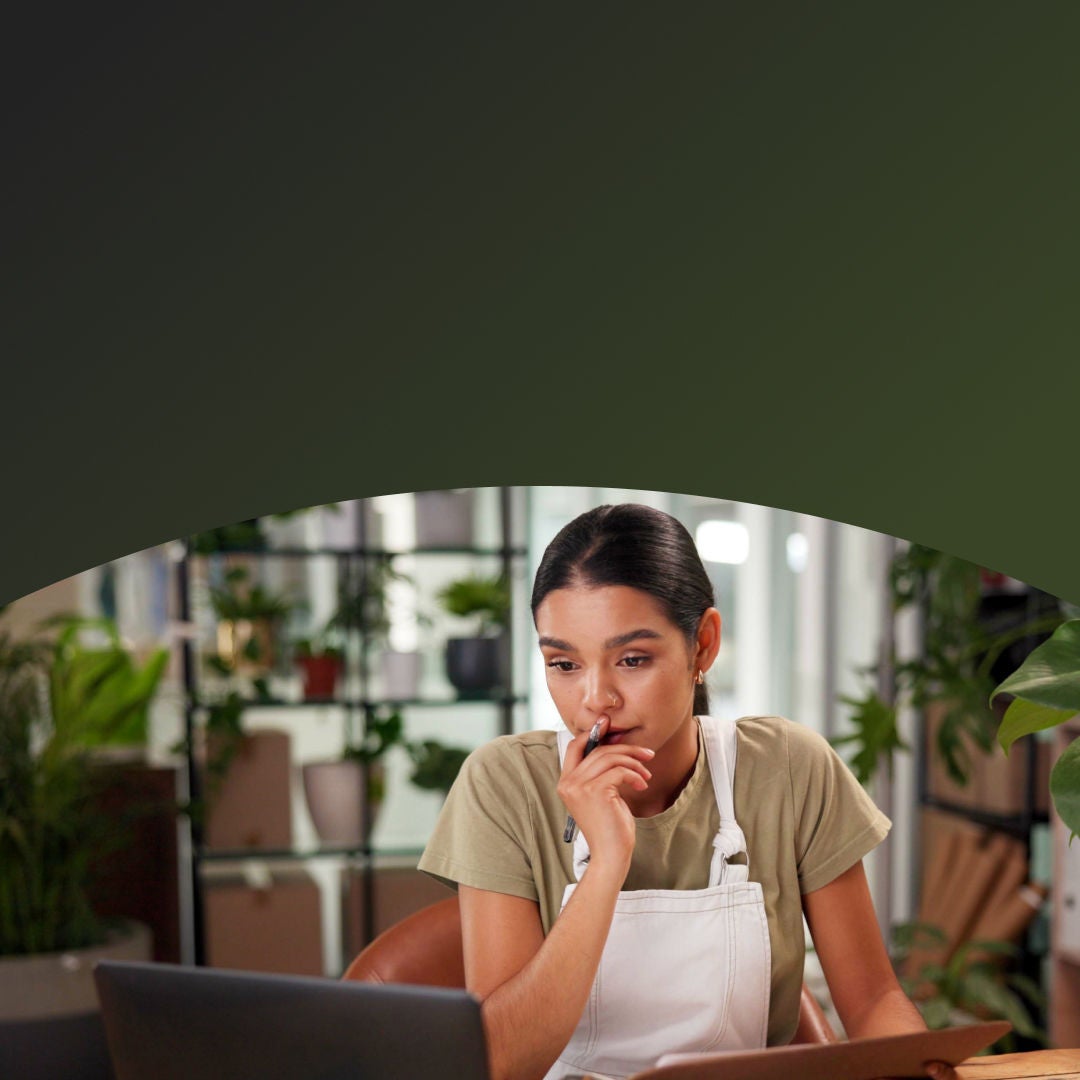 Woman on her computer taking stock