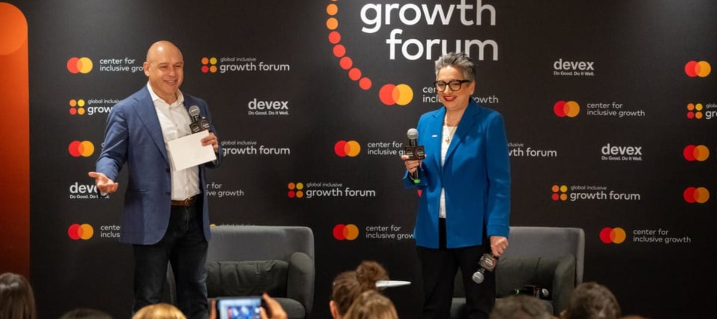 Raj Kumar and Shamina Singh on stage at the Global Inclusive Growth Forum in D.C.
