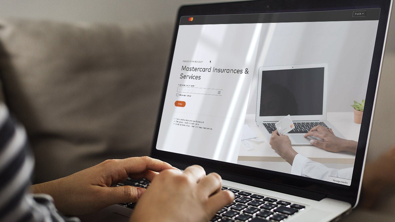 A person on a laptop using the Mastercard benefits website.