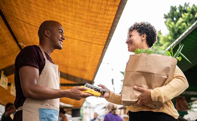 Woman paying for groceries
