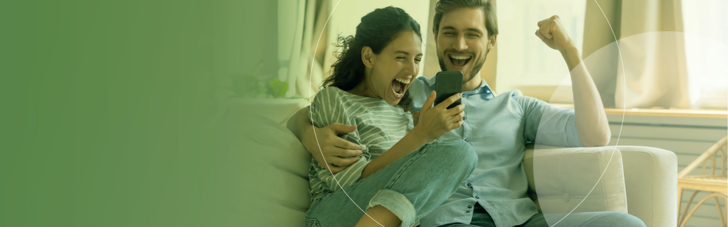 Couple on phone celebrating