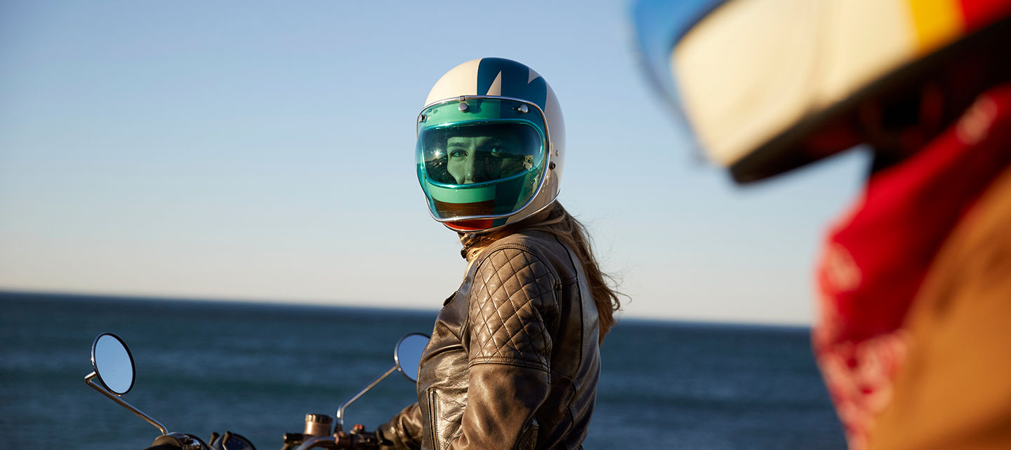 Two people on motorcycles about to take a joy ride