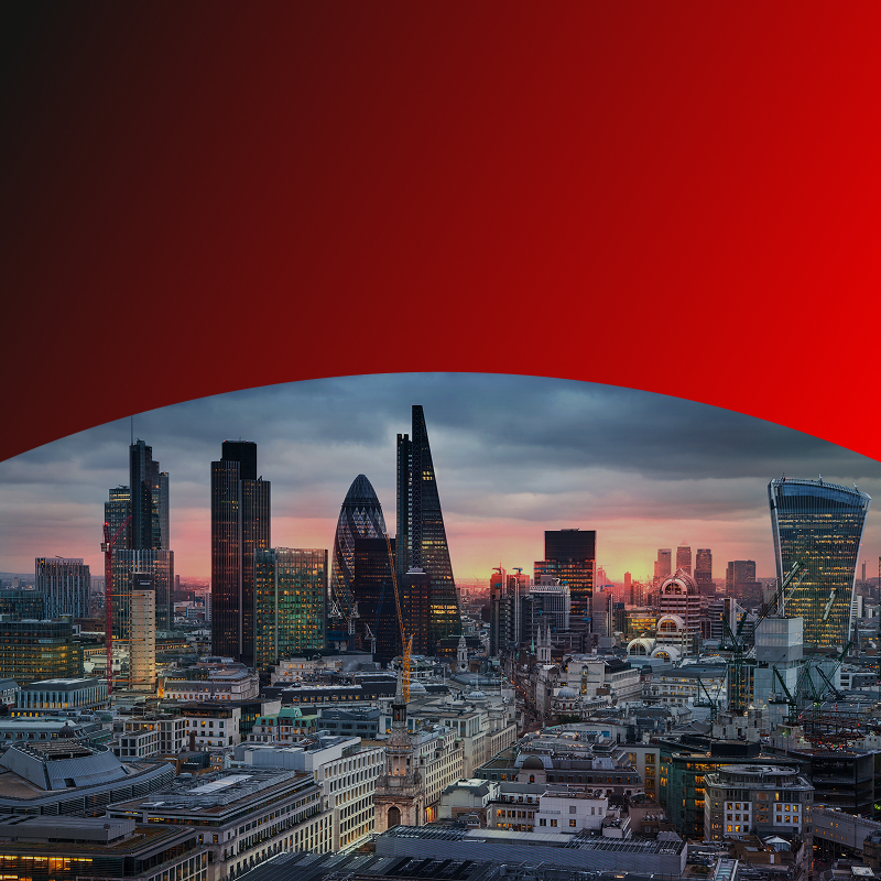 A cityscape with a red sky