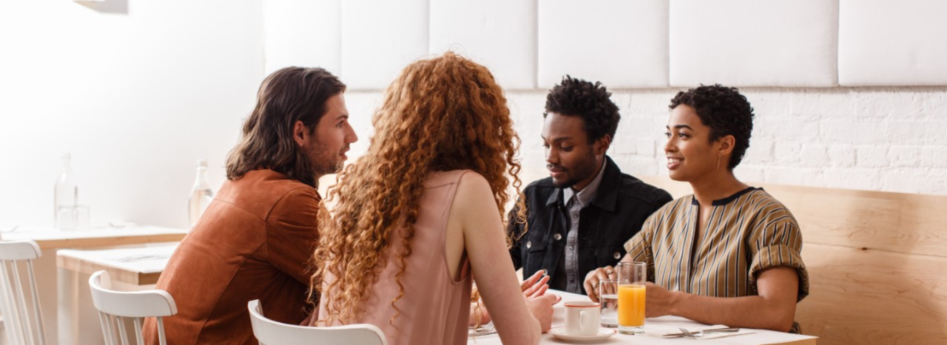 group of people chatting at table