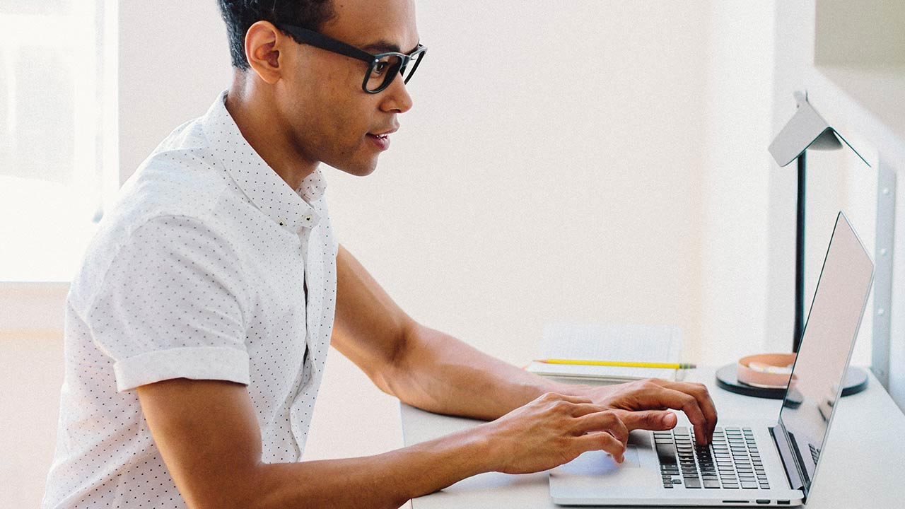 Man working on a laptop.