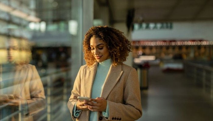 Woman on her phone in the store