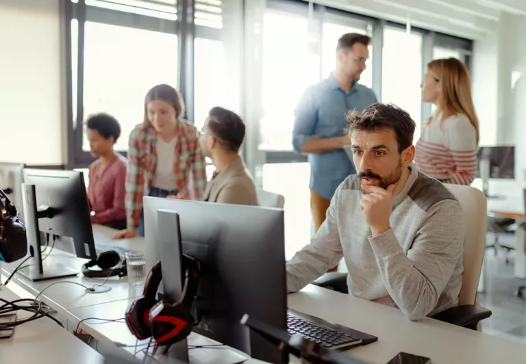Man looking at computer at an office