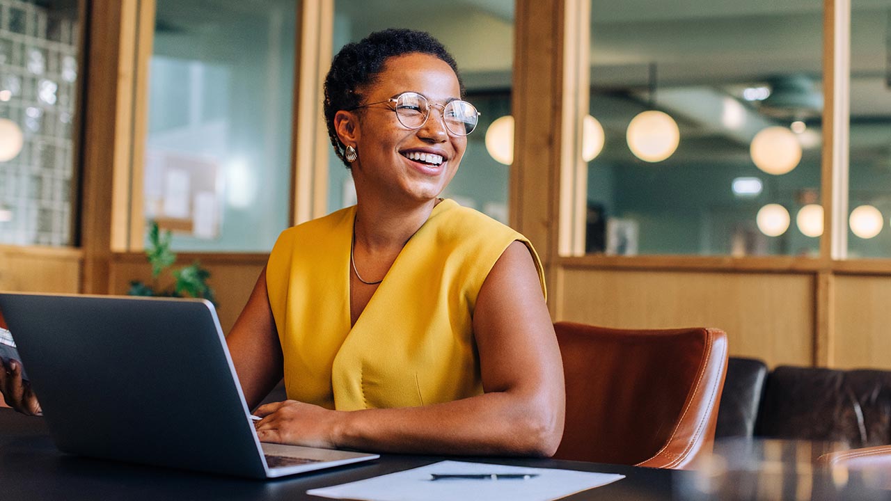 Confident restaurant owner in a dining room.