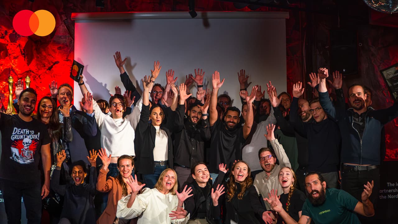 group celebration hands raised indoors 2025