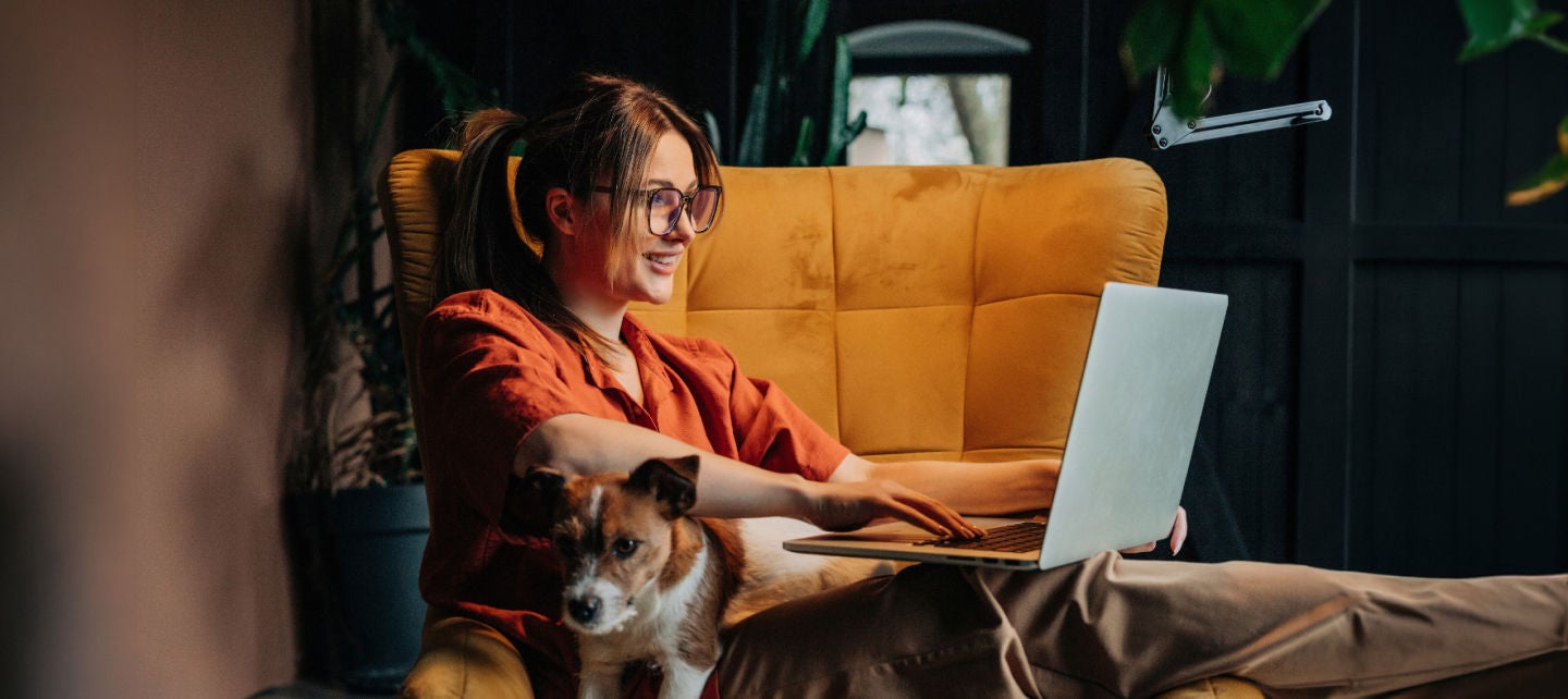 Woman on her laptop smiling