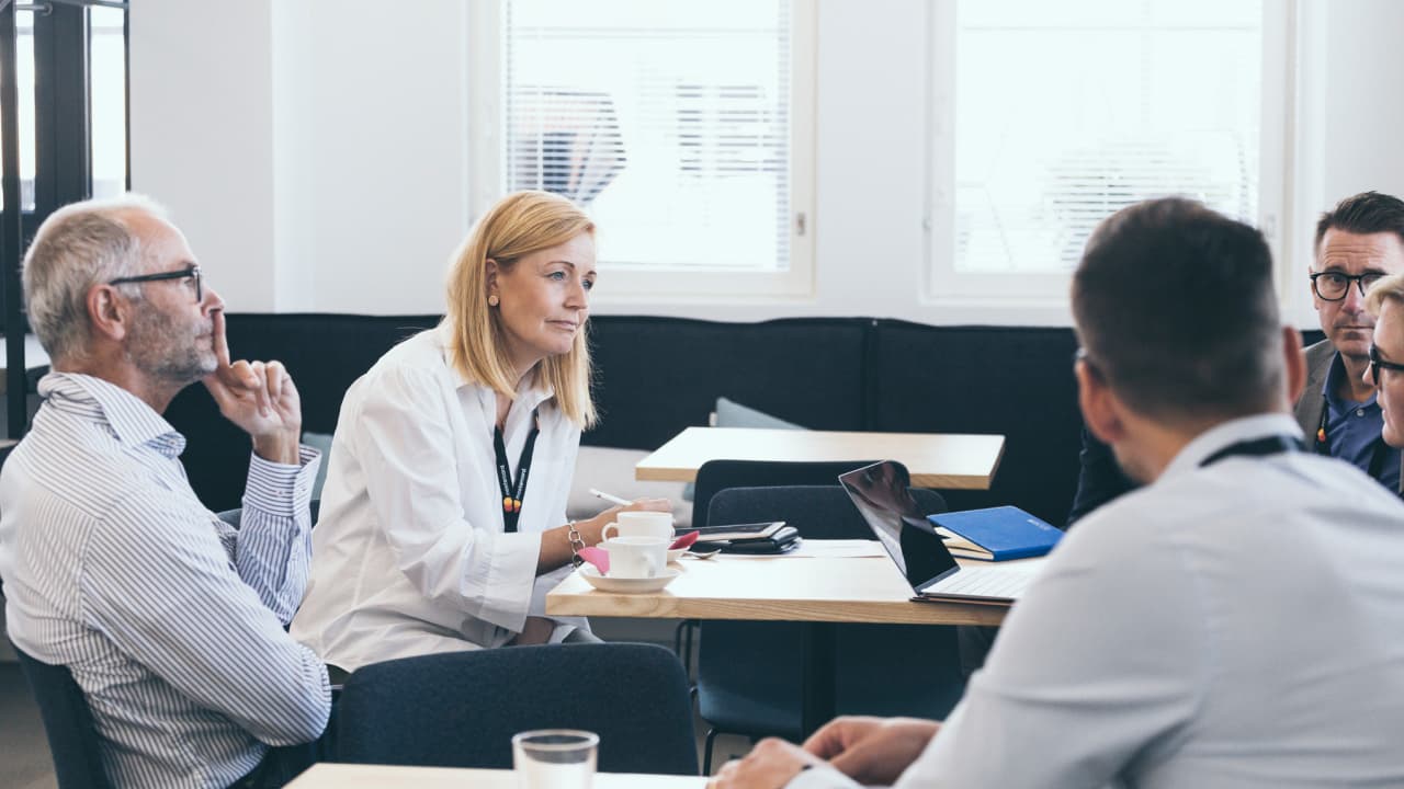people having meeting in an office