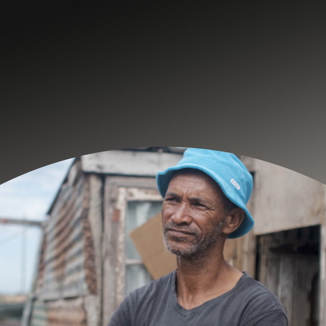 Man wearing hat looking off into the distance