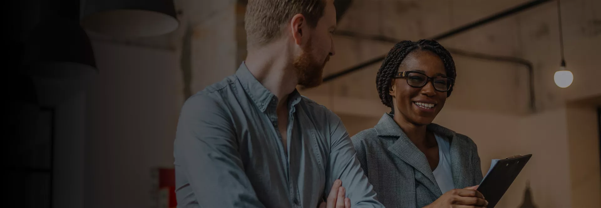 Coworkers using a laptop