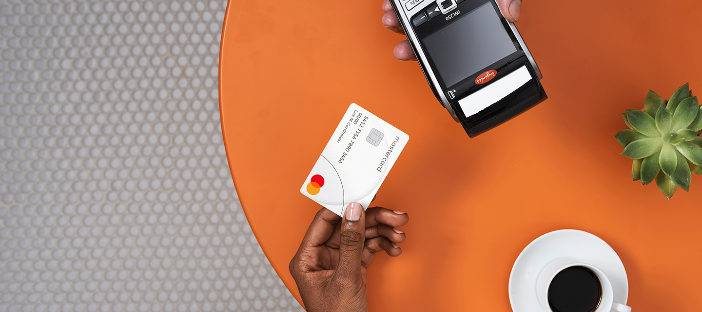 Someone paying with a Mastercard with tap to pay