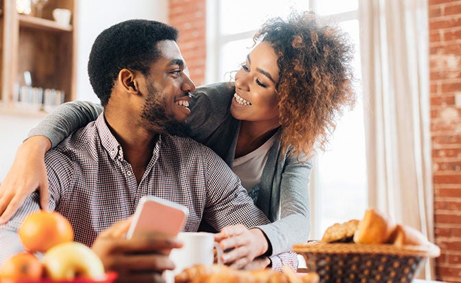 Two people enjoying food.