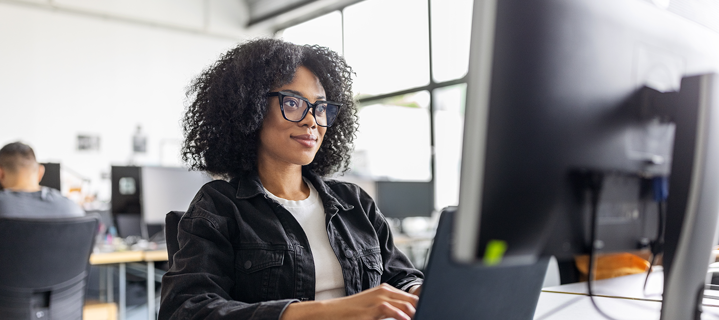 Woman working on her laptop in the office