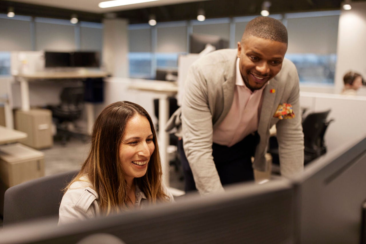 Man and woman at desk working