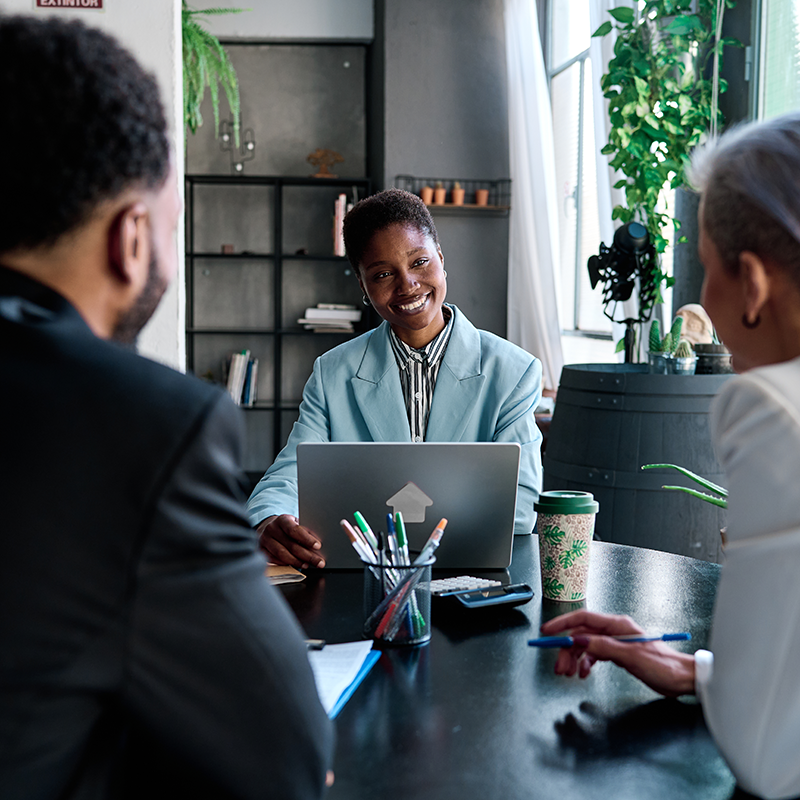 Man and woman discussing business while getting coffee