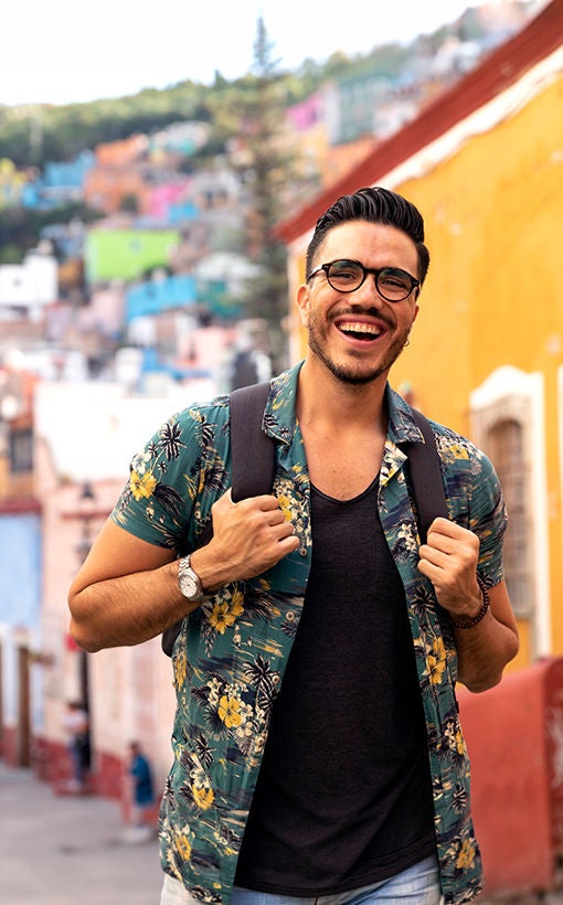 Man in colorful shirt backpacking
