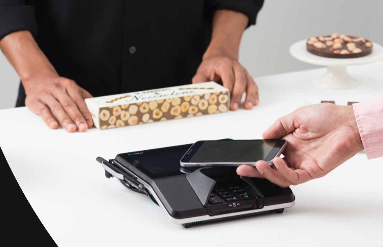 Person paying with phone