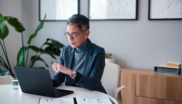 Woman analyzing data on her tablet