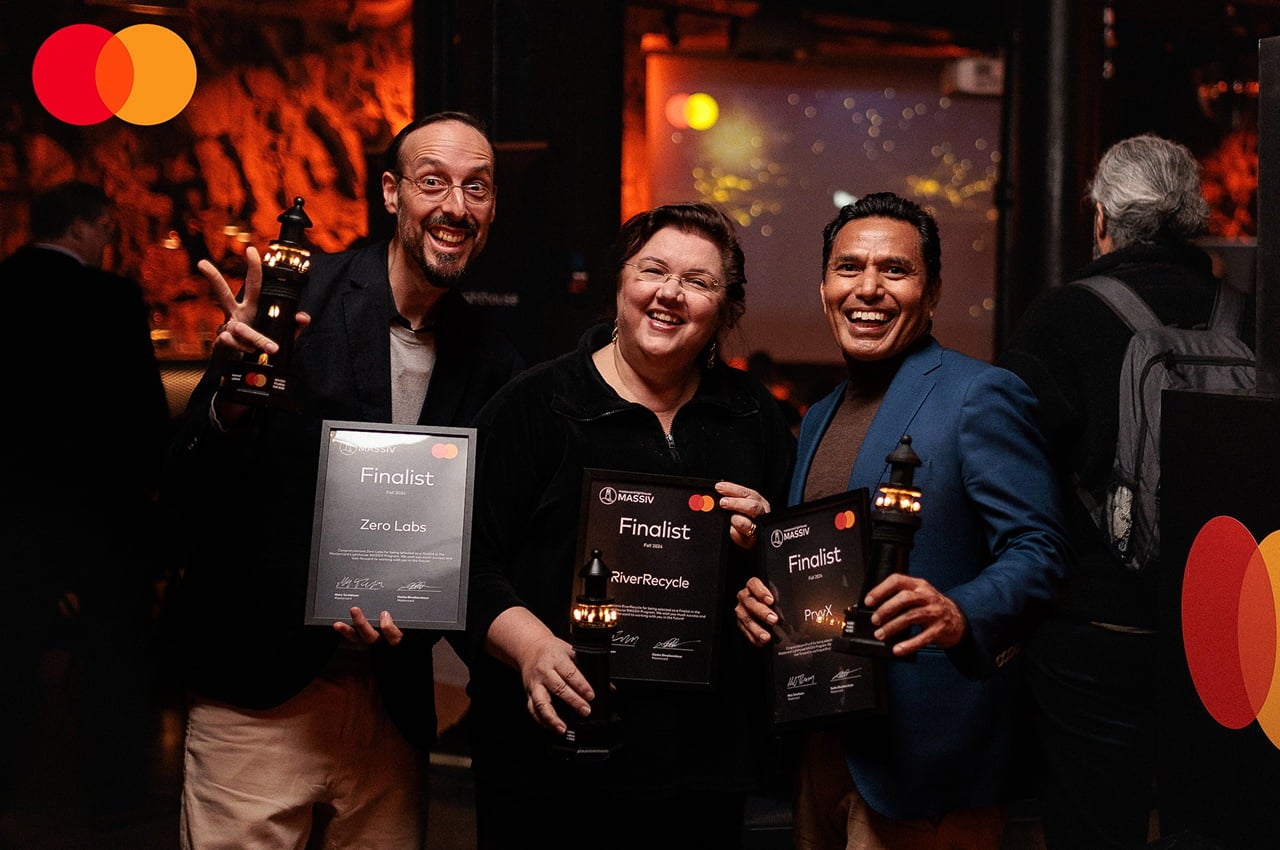 three finalists holding award certificates