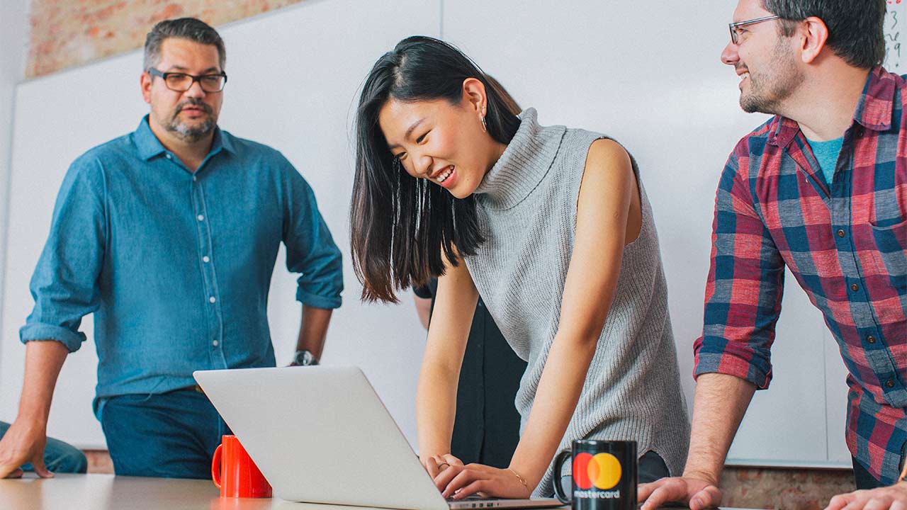 Family unpacking groceries. Instacart logo.