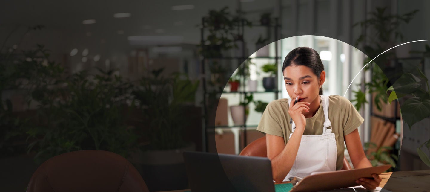 Woman thinking deeply in her store