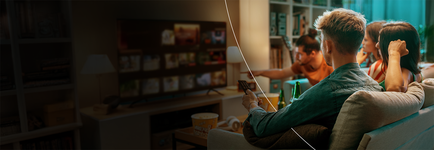 Group sitting around a TV