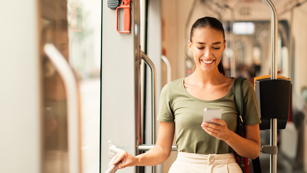 Happy girl using her phone