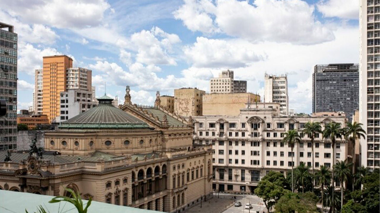 Family unpacking groceries. Instacart logo.
