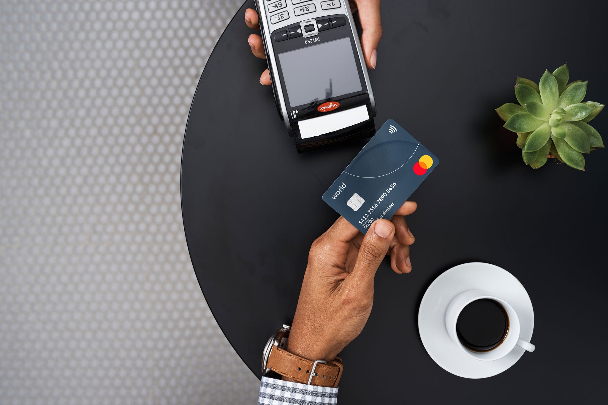 man making payment with credit card