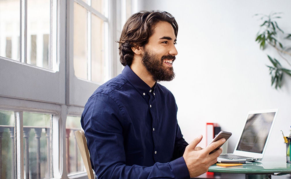 Happy man in a blue shirt