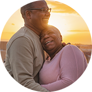 Man and woman smiling and embracing 