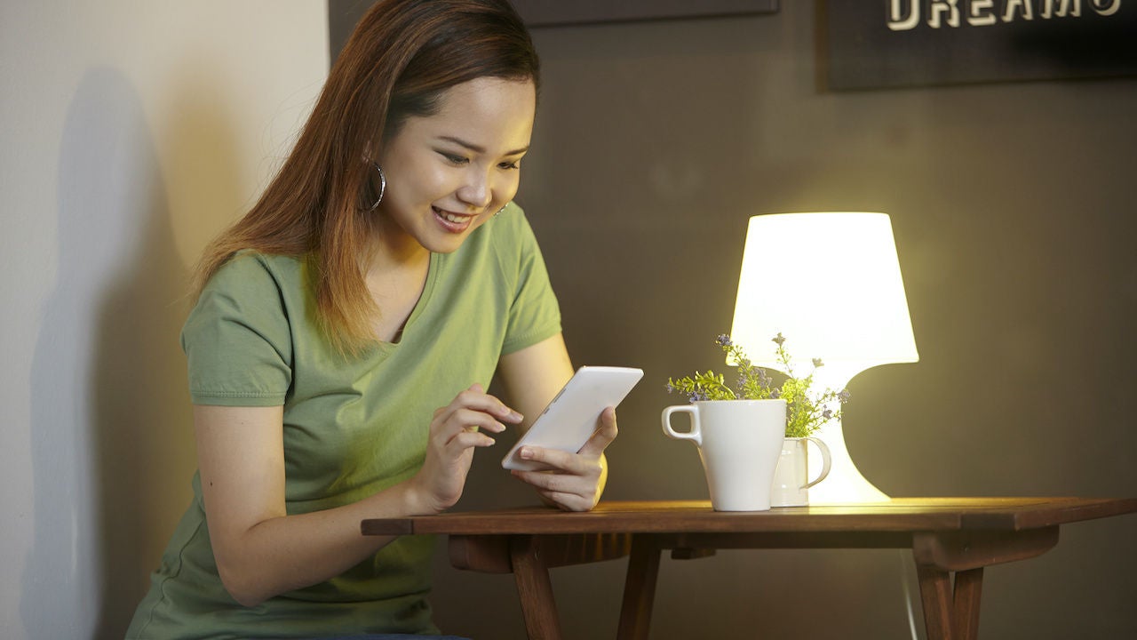 Woman smiling at phone
